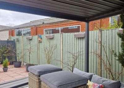 Garden with old timber fencing before new composite fencing