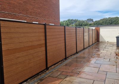 Oak effect composite fencing and gates