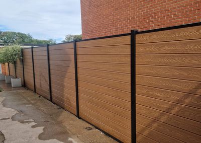 Oak effect composite fencing and gates