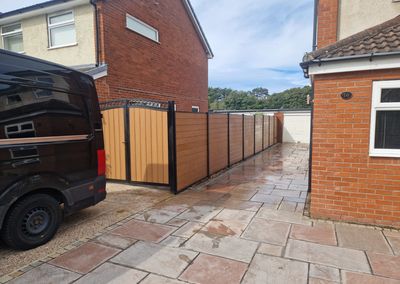 Oak effect composite fencing and gates