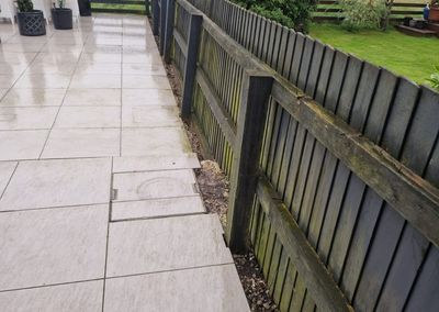 Composite fencing on a patio next to an old timber fence