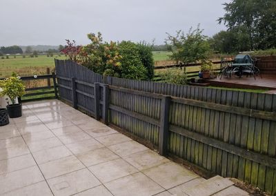 Composite fencing on a patio next to an old timber fence