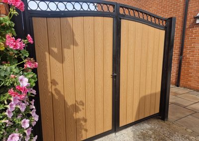 Oak effect composite double gate with arched black frame